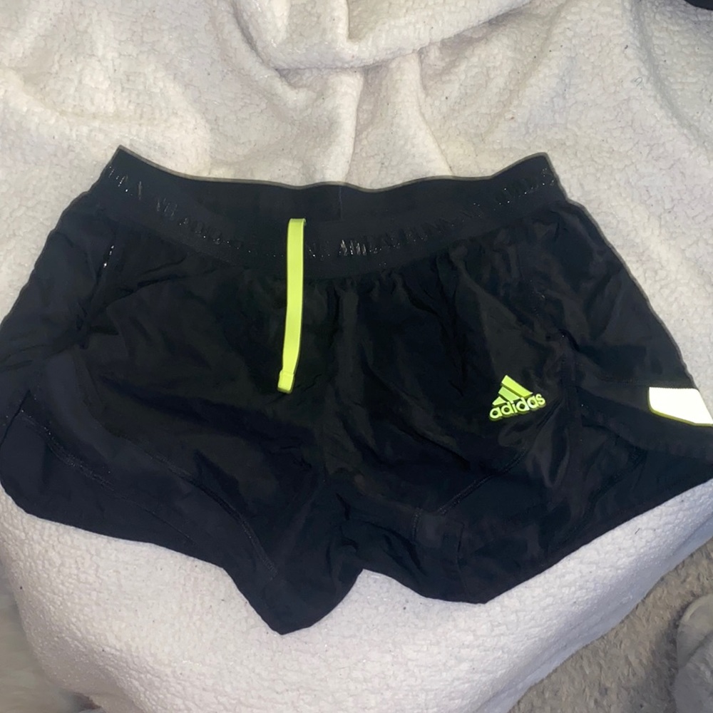 Adidas black and yellow running shorts